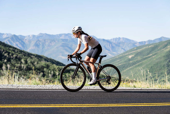 Cyclist riding through the mountains on a bike
